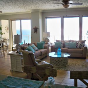 View of the living room, dining area, balcony, and beautiful view