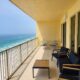 Balcony with chairs, 4 seat table and view of Gulf of Mexico